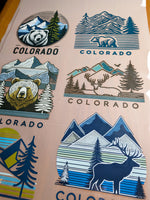 Colorado sticker sheet with bear, deer, and mountain designs.