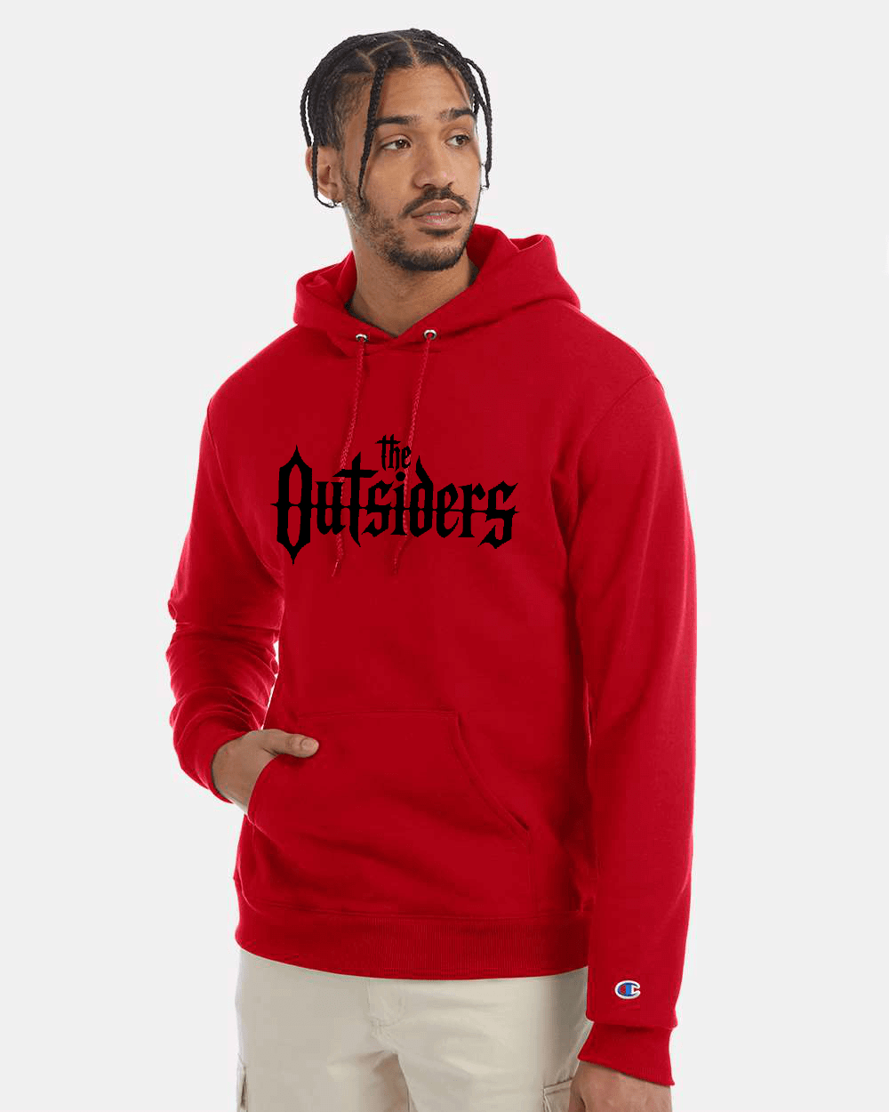 Man wearing a red hoodie with The Outsiders printed on it.