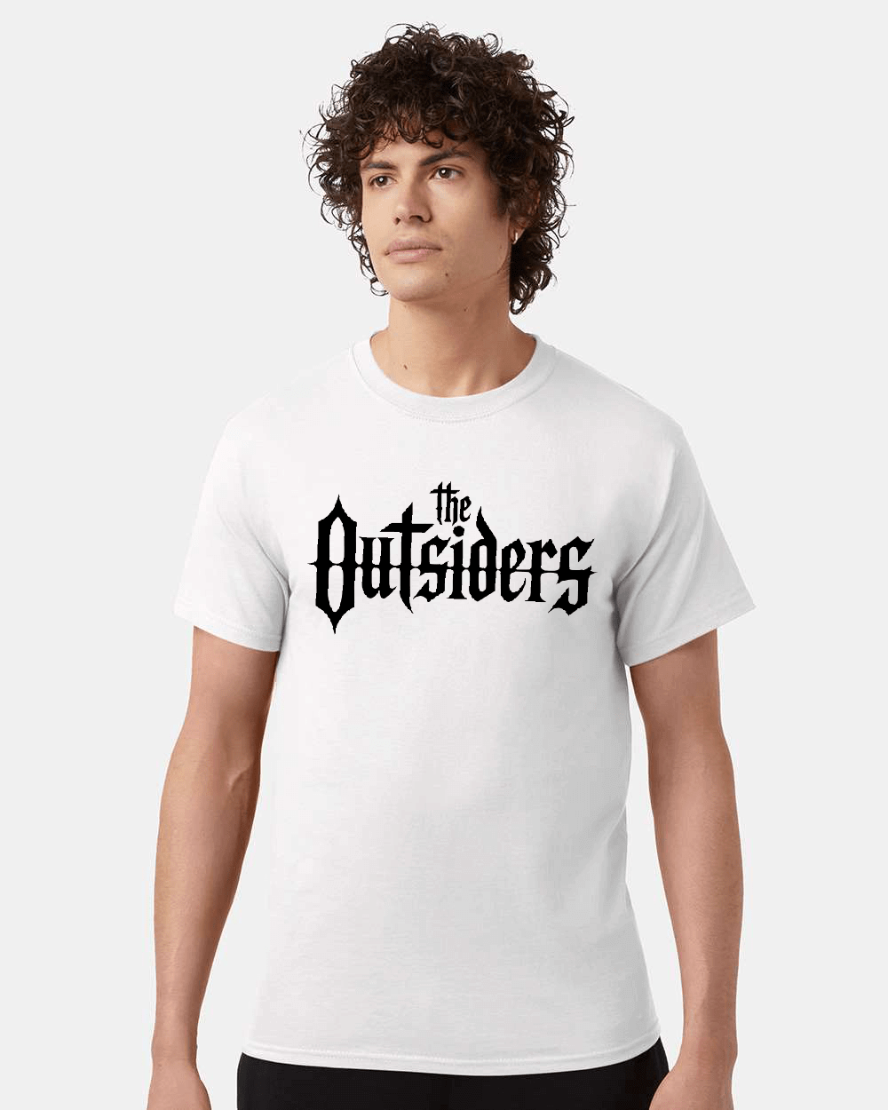 Man wearing a white t-shirt with The Outsiders logo.