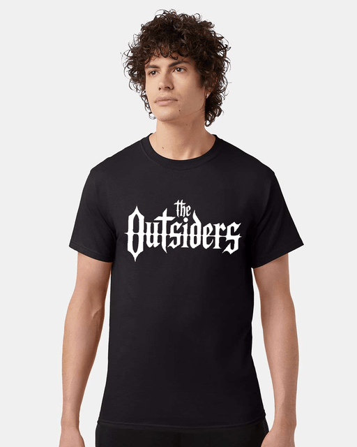 Man wearing a black t-shirt with The Outsiders logo.
