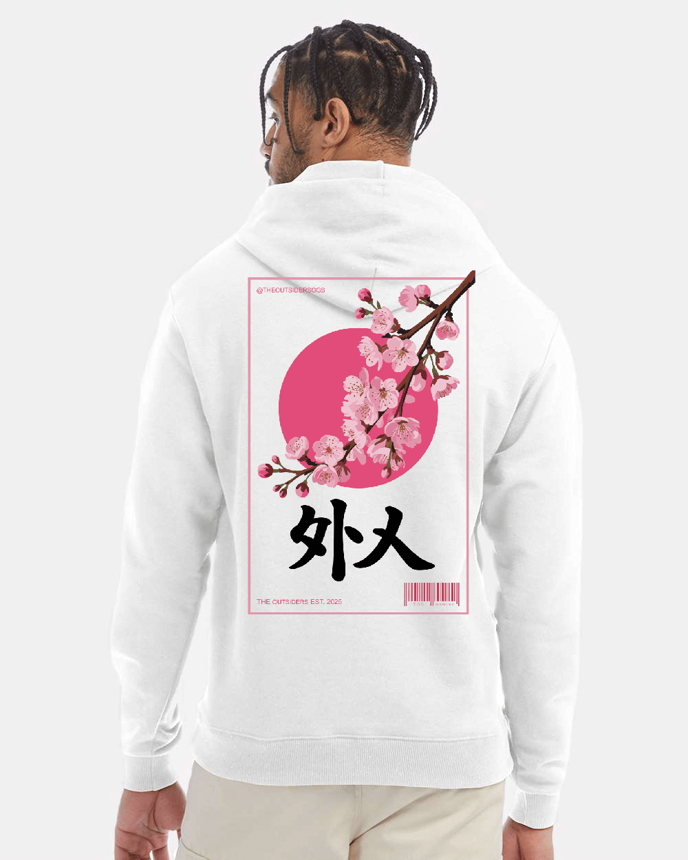 Man in white hoodie with Japanese cherry blossom design.